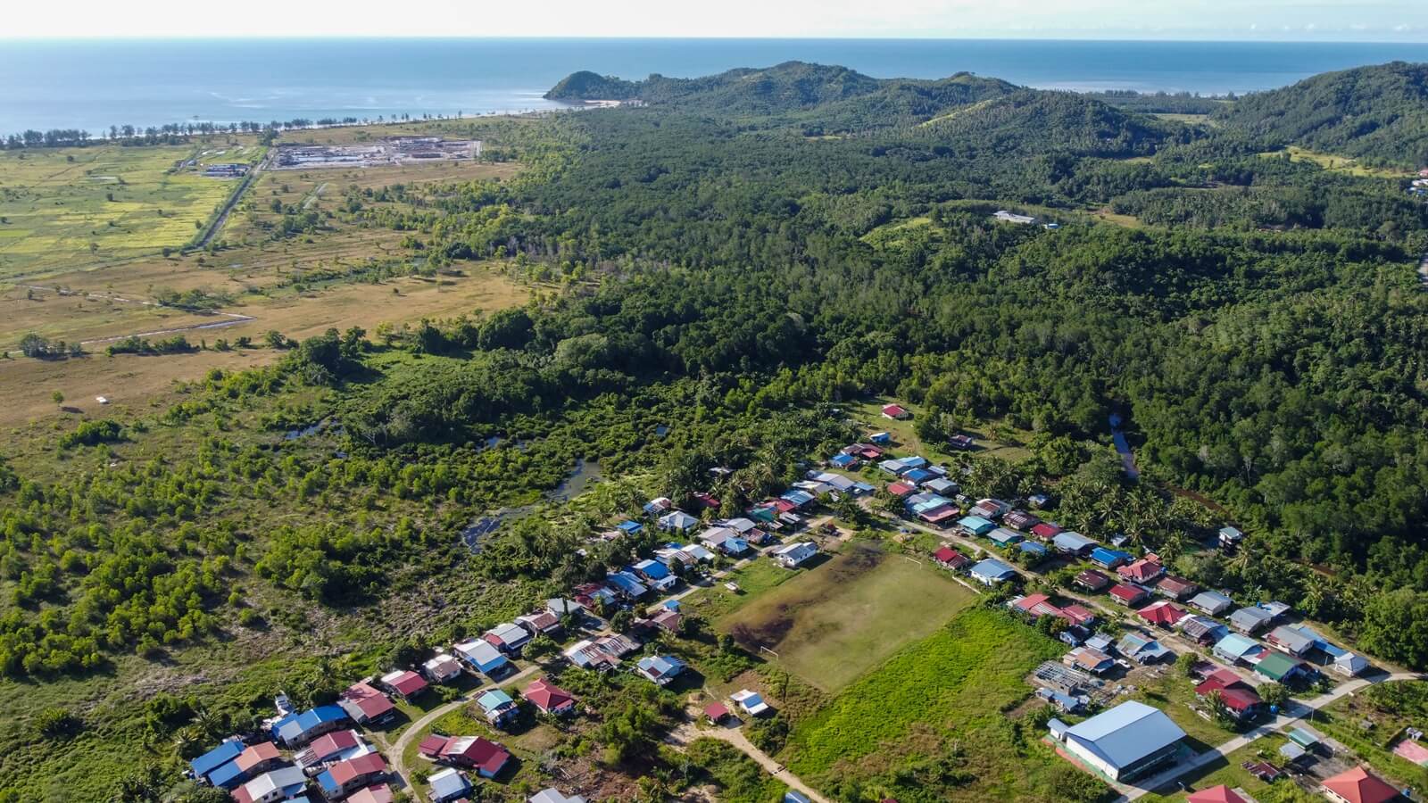 Living only 500 metres from the sand mining site (top left), some villagers in Kampung Andab Bangau are worried for their health and safety. (Chen Yih Wen)
